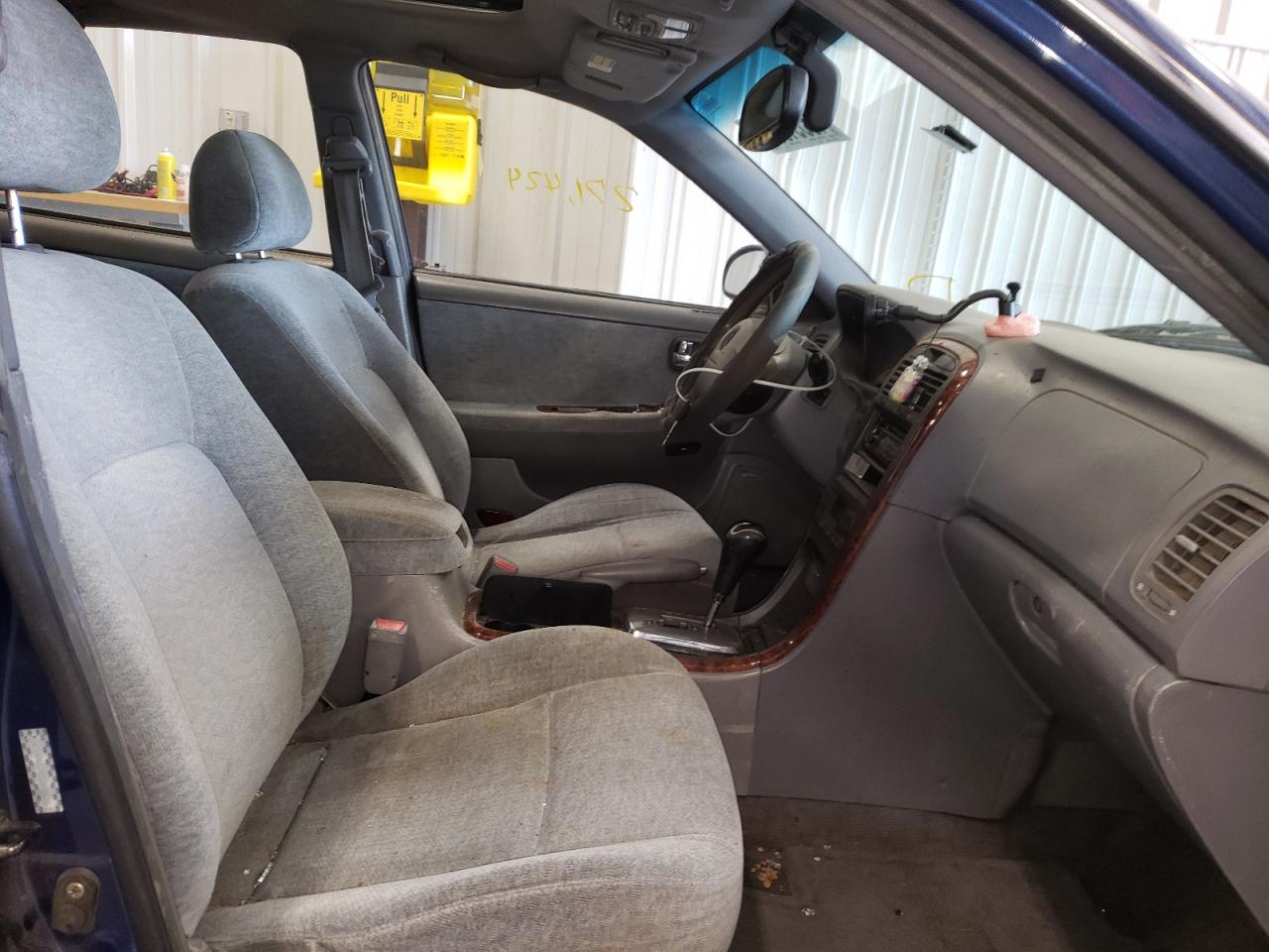Photo 5 from auction – 2003 KIA OPTIMA LX with VIN KNAGD128935204571