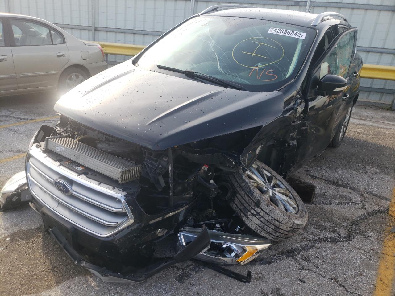 Photo 9 from auction – 2017 FORD ESCAPE TIT with VIN 1FMCU0J98HUE56293