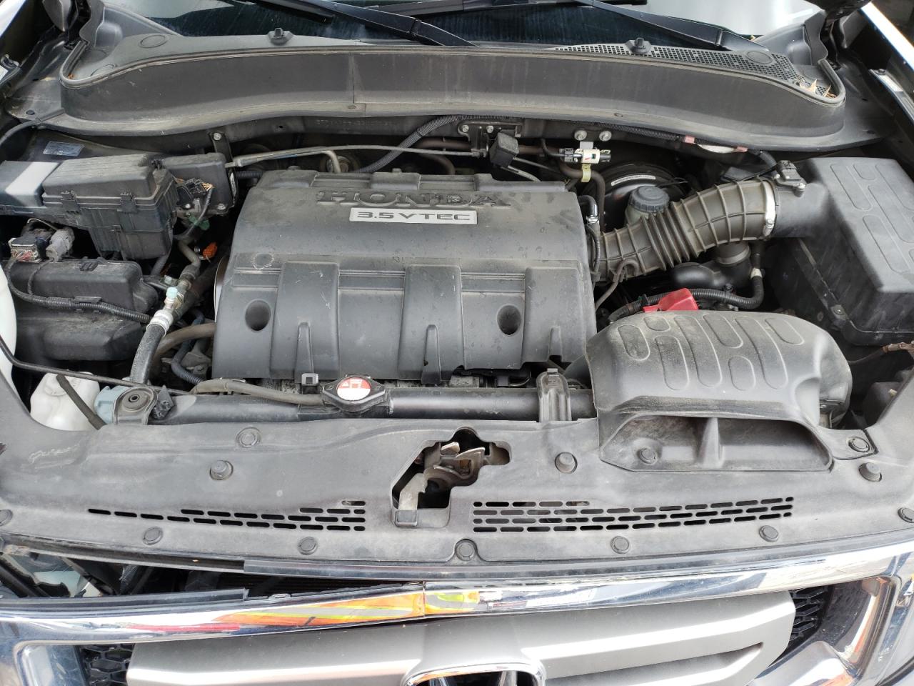 Photo 7 from auction – 2011 HONDA RIDGELINE with VIN 5FPYK1F54BB007132