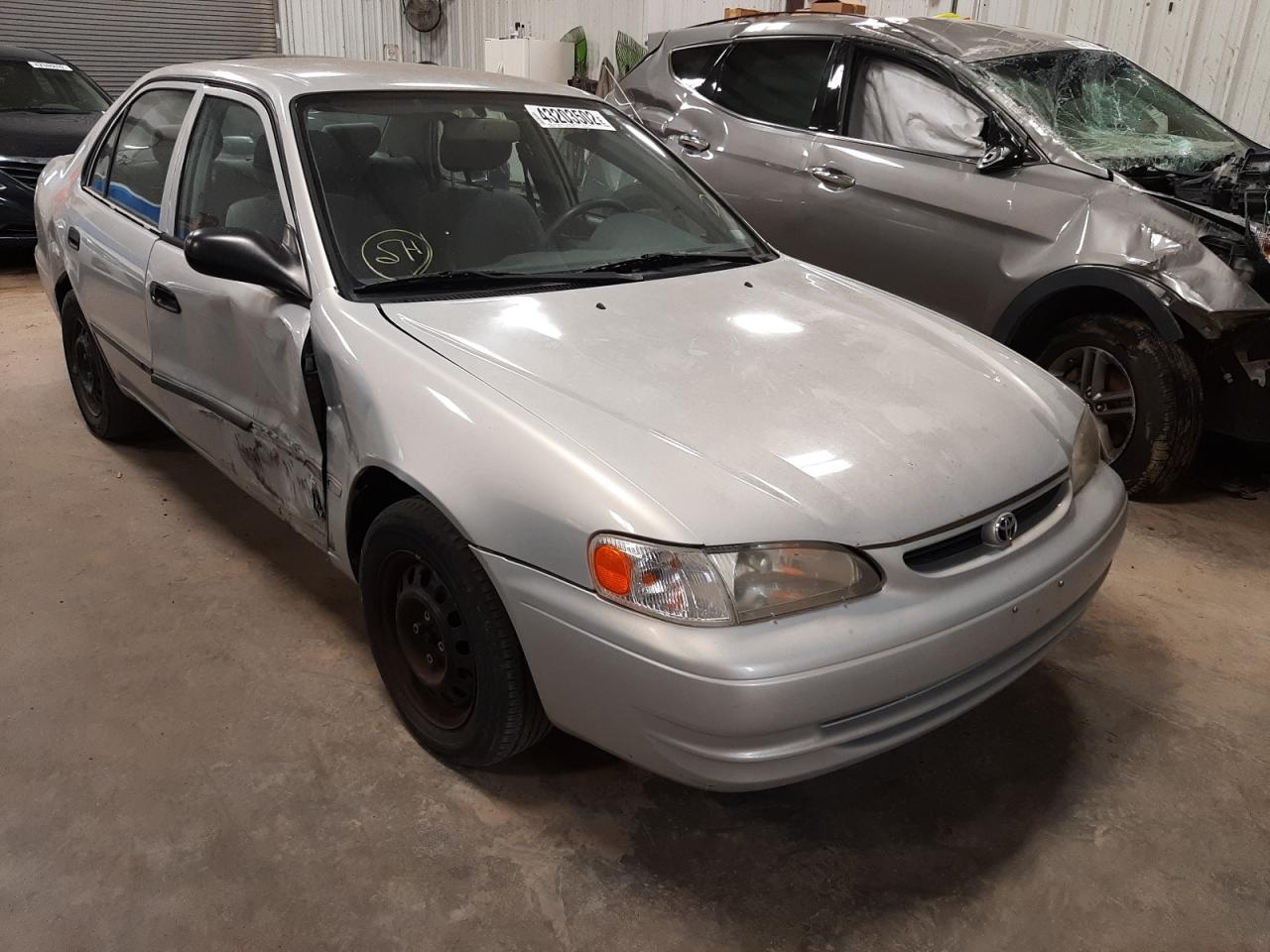 TOYOTA COROLLA VE 2000 with VIN 1NXBR12E5YZ409124 - Photo from auction