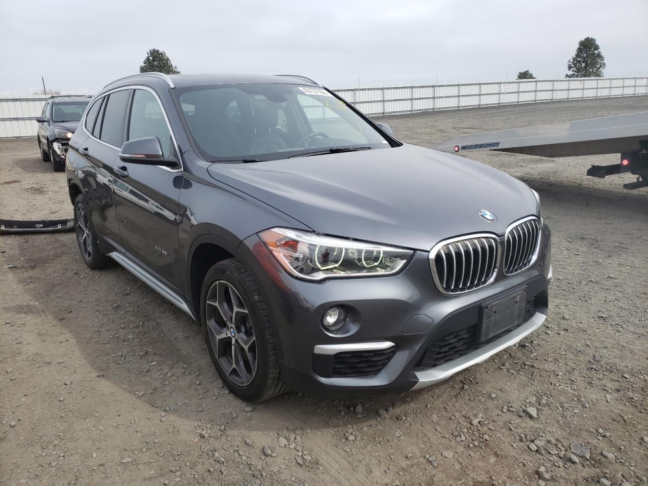 BMW X1 2017 with VIN WBXHT3Z35H4A56566 - Photo from auction