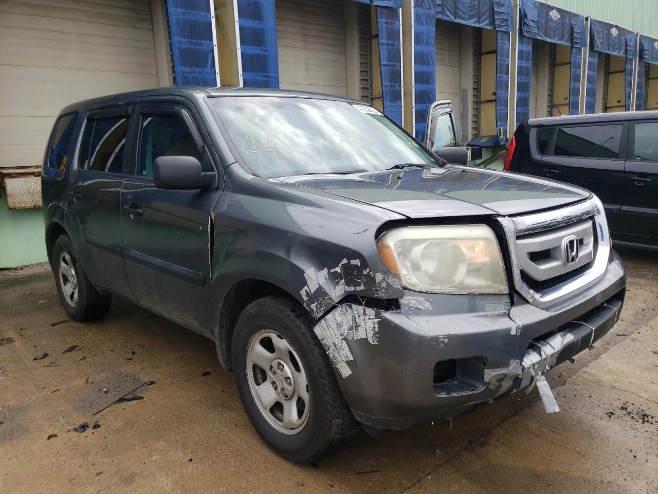 HONDA PILOT LX 2011 with VIN 5FNYF4H29BB059857 - Photo from auction