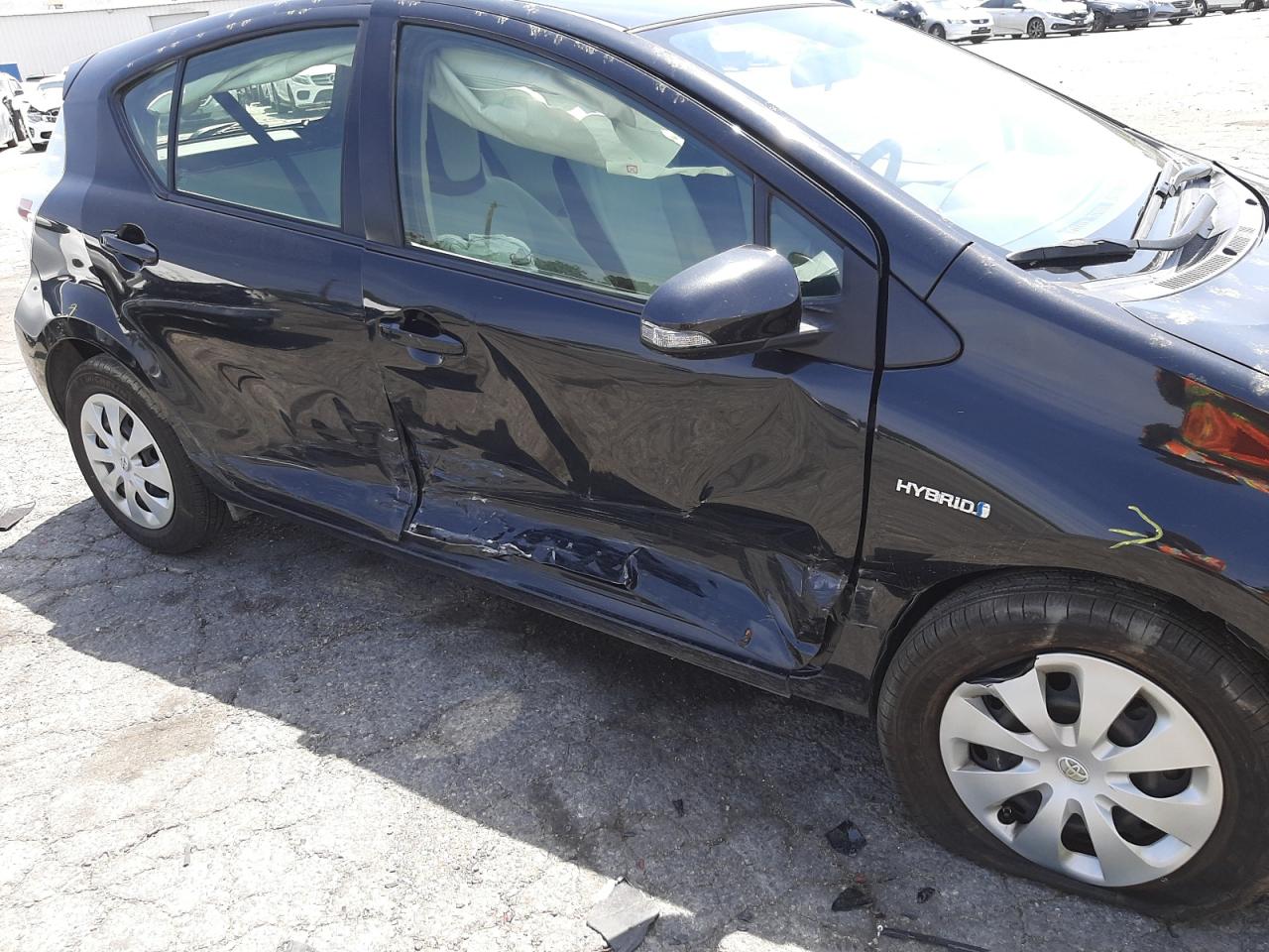 Photo 9 from auction – 2014 TOYOTA PRIUS C with VIN JTDKDTB36E1062901