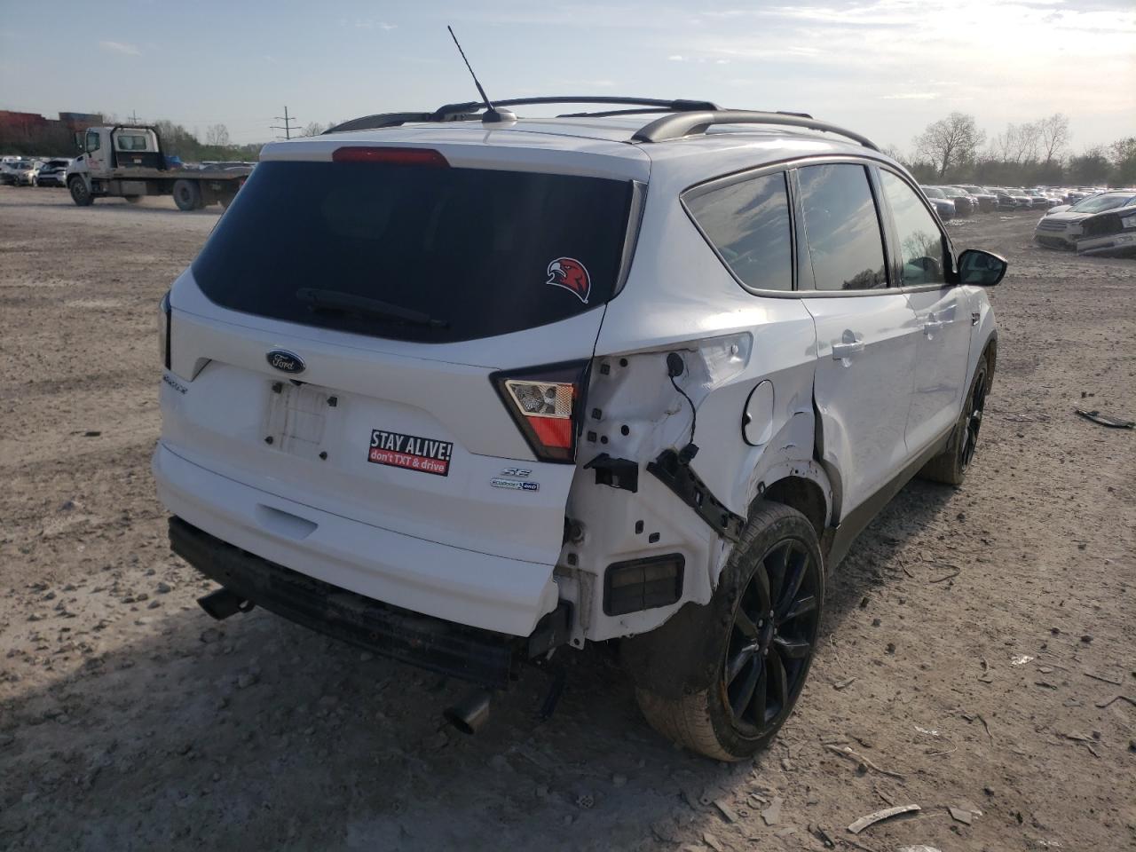 Photo 9 from auction – 2017 FORD ESCAPE SE with VIN 1FMCU9GD0HUD57175