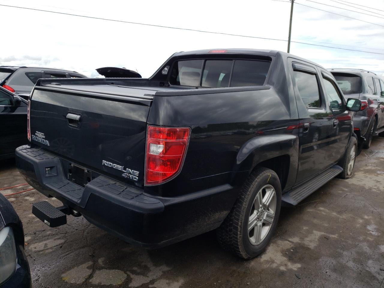 Photo 4 from auction – 2011 HONDA RIDGELINE with VIN 5FPYK1F54BB007132