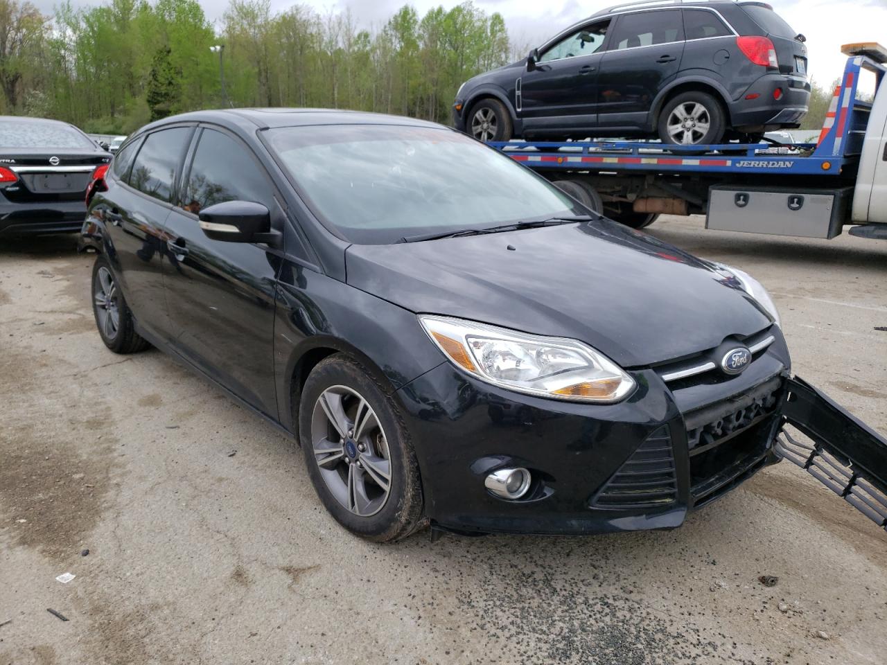 FORD FOCUS SE 2014 with VIN 1FADP3K21EL128921 - Photo from auction