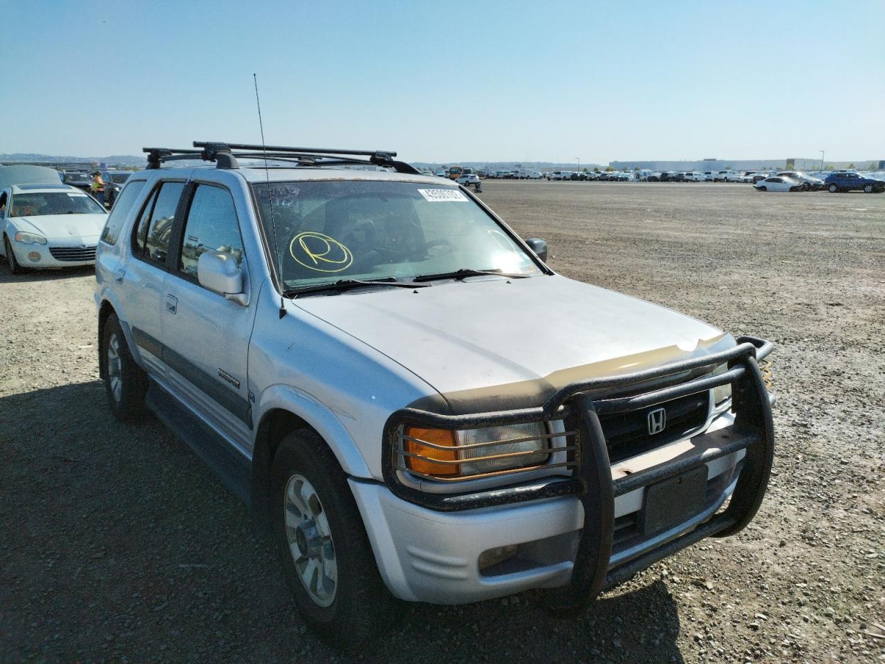 HONDA PASSPORT E 1999 with VIN 4S6CM58W7X4406645 - Photo from auction
