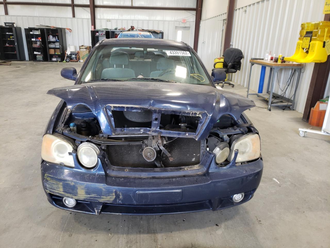 Photo 9 from auction – 2003 KIA OPTIMA LX with VIN KNAGD128935204571