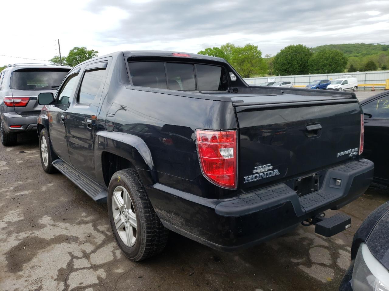 Photo 3 from auction – 2011 HONDA RIDGELINE with VIN 5FPYK1F54BB007132
