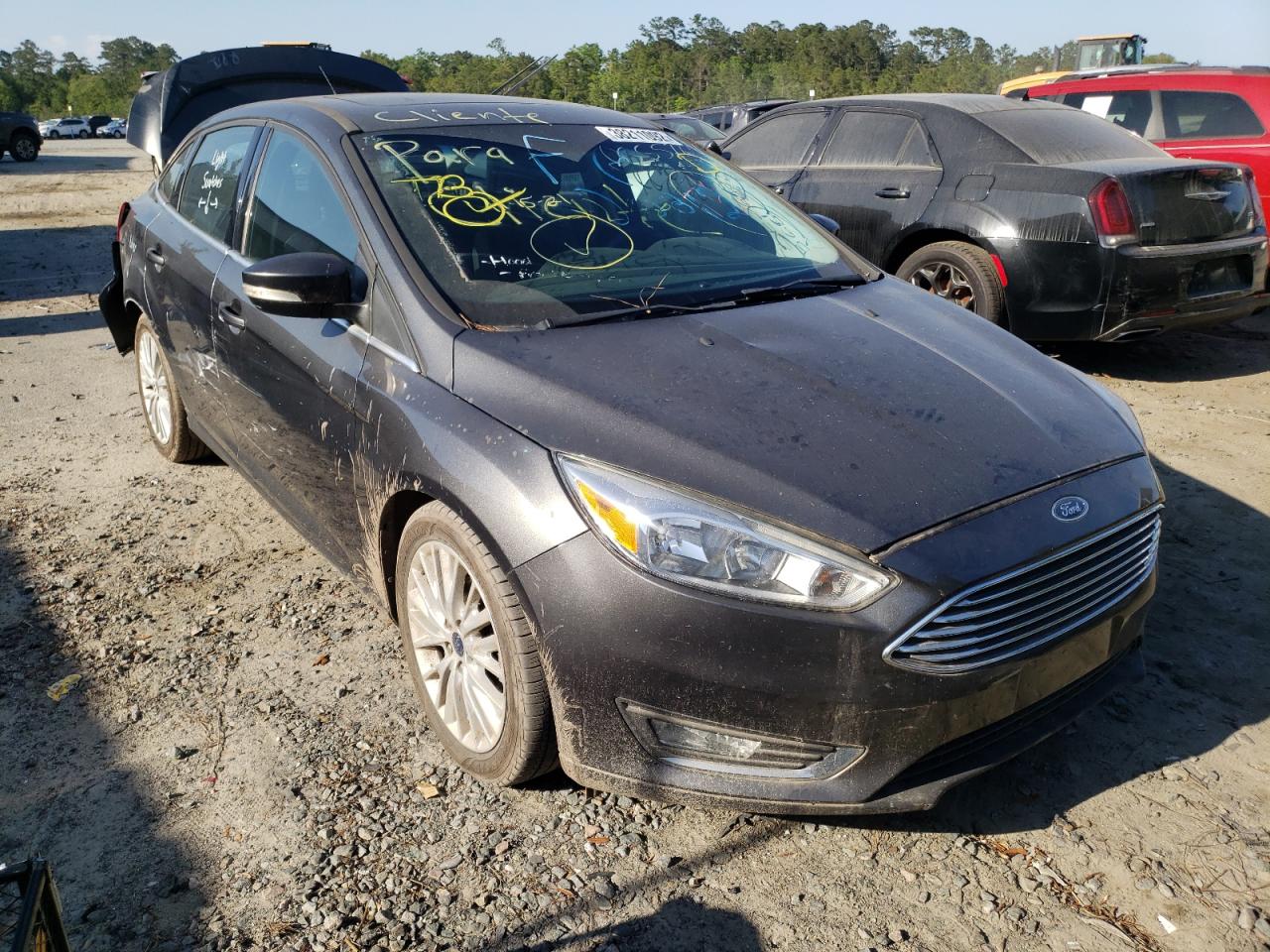 FORD FOCUS TITA 2017 with VIN 1FADP3J22HL208122 - Photo from auction