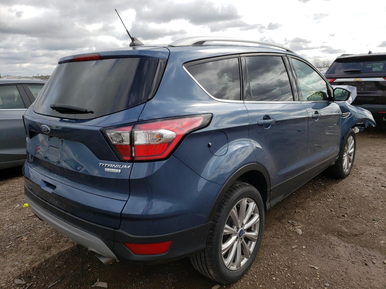 Photo 4 from auction – 2018 FORD ESCAPE TIT with VIN 1FMCU0J97JUC56608