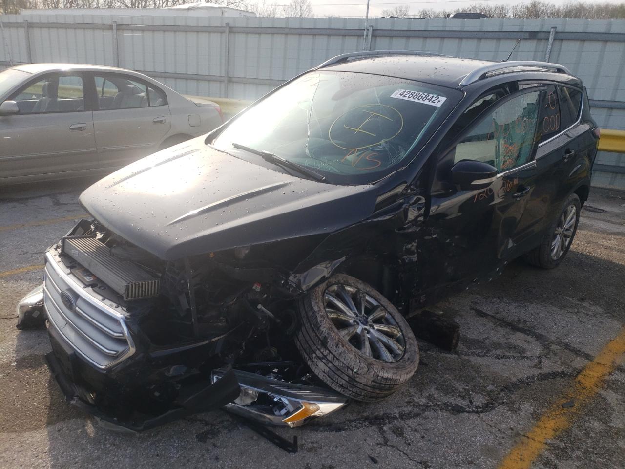 Photo 2 from auction – 2017 FORD ESCAPE TIT with VIN 1FMCU0J98HUE56293