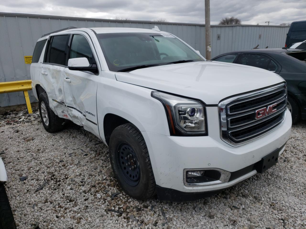 GMC YUKON SLT 2017 with VIN 1GKS2BKC1HR125915 - Photo from auction