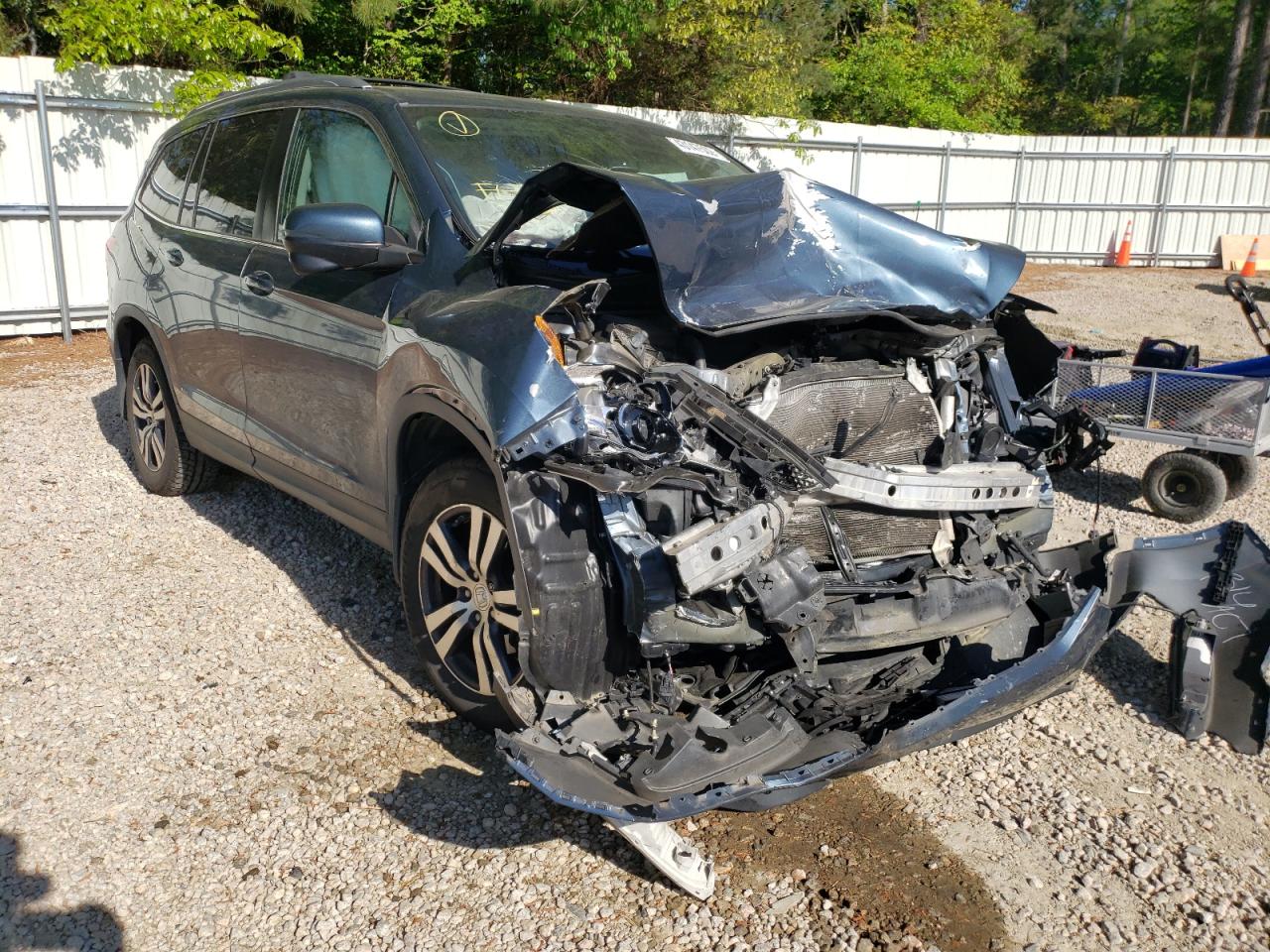 HONDA PILOT EXL 2017 with VIN 5FNYF5H59HB030206 - Photo from auction