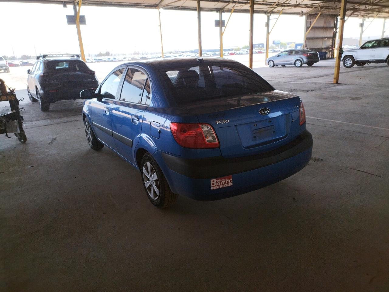 Photo 3 from auction – 2009 KIA RIO BASE with VIN KNADE223X96537214