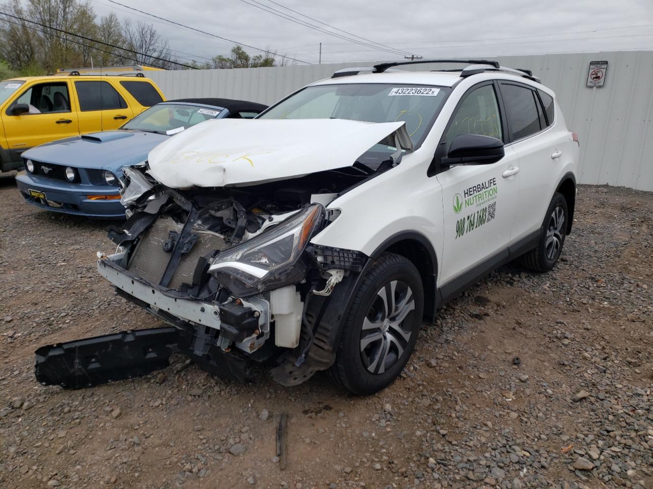 Photo 2 from auction – 2016 TOYOTA RAV4 LE with VIN JTMBFREV2GJ096573