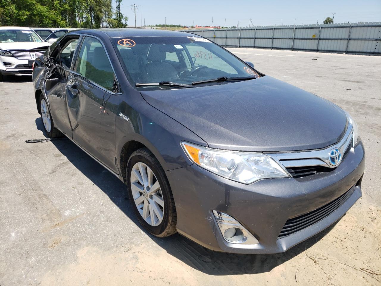 TOYOTA CAMRY HYBR 2012 with VIN 4T1BD1FKXCU013813 - Photo from auction