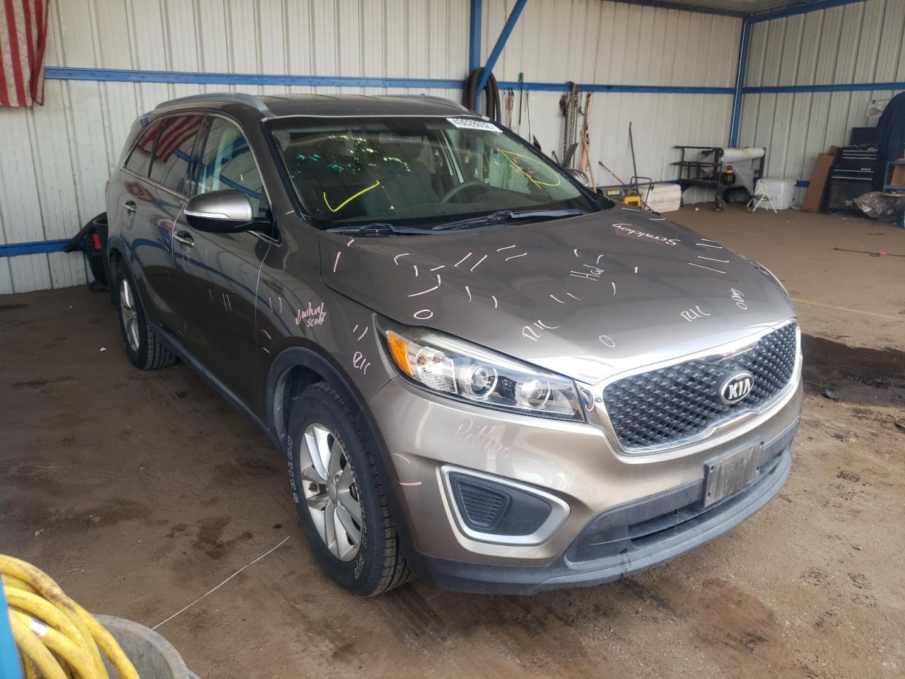 KIA SORENTO LX 2016 with VIN 5XYPG4A59GG014303 - Photo from auction