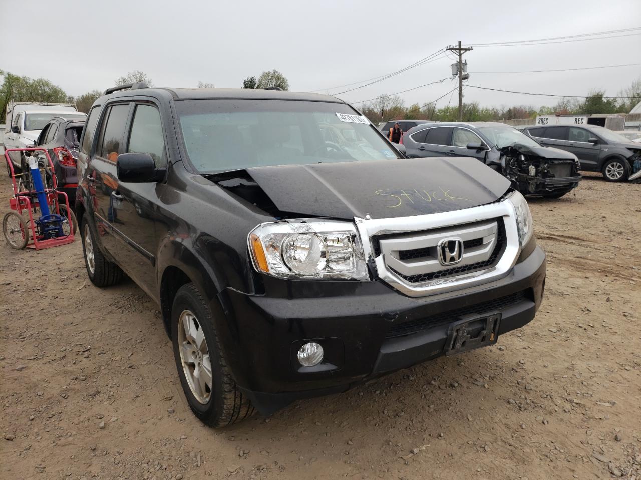 HONDA PILOT EXL 2011 with VIN 5FNYF4H56BB106157 - Photo from auction