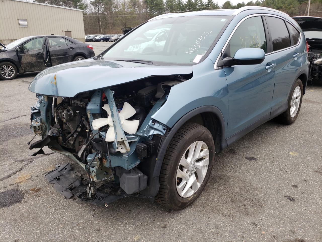Photo 2 from auction – 2015 HONDA CR-V EXL with VIN 2HKRM4H78FH603469