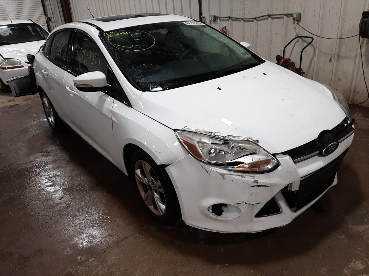 FORD FOCUS SE 2014 with VIN 1FADP3F2XEL170921 - Photo from auction