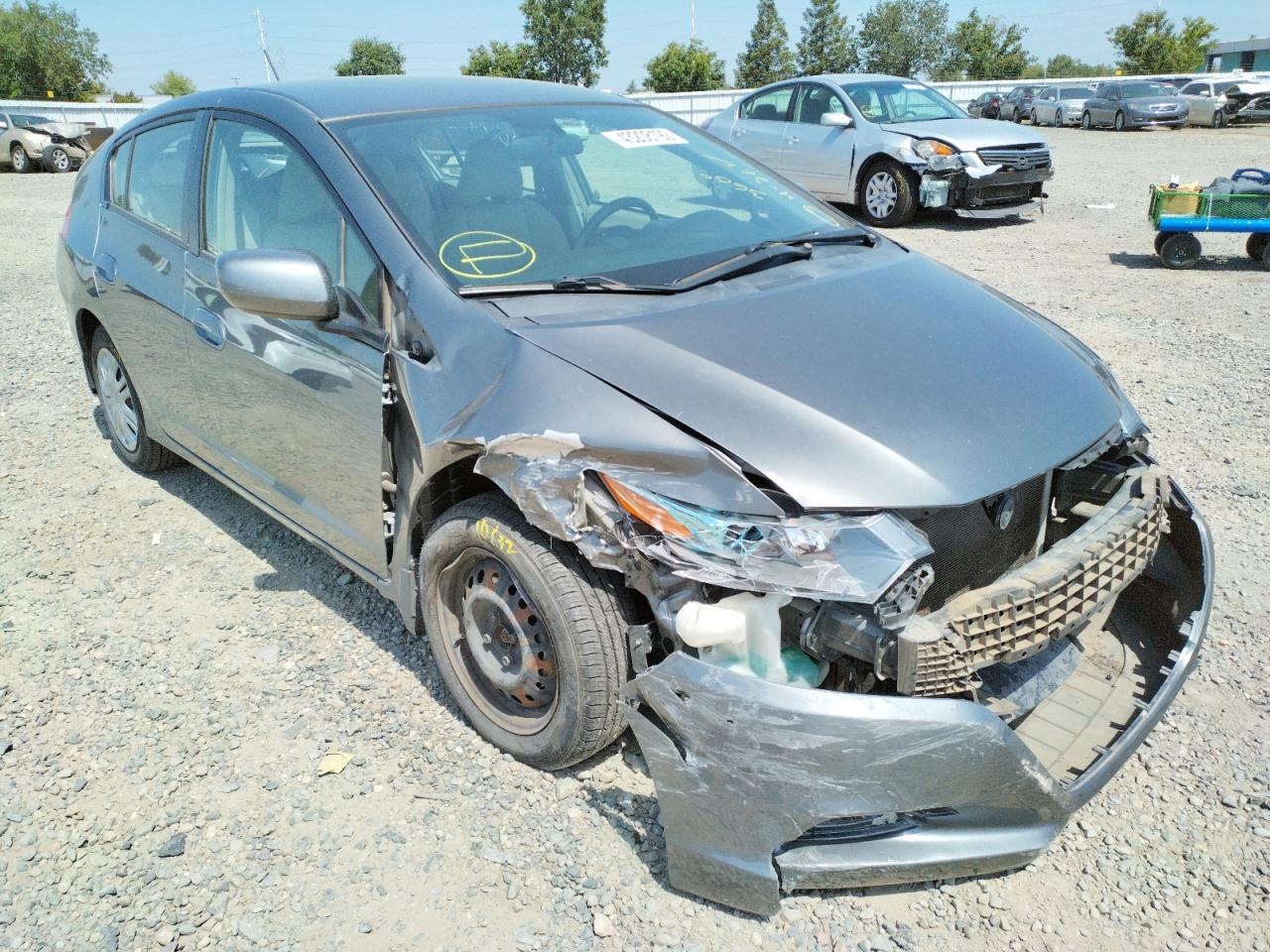 HONDA INSIGHT LX 2011 with VIN JHMZE2H56BS002586 - Photo from auction