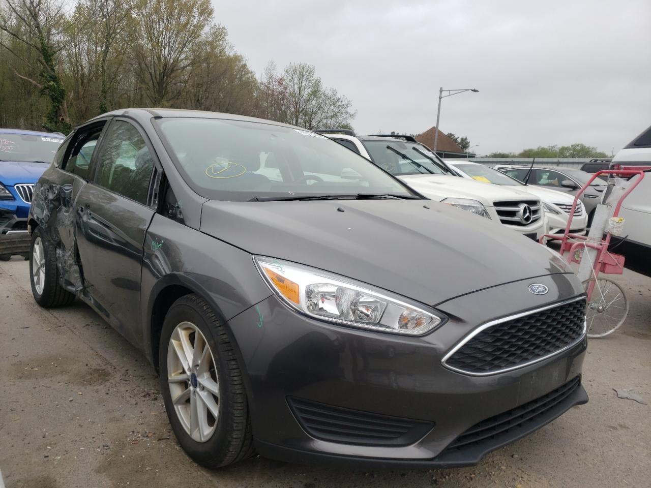 FORD FOCUS SE 2018 with VIN 1FADP3K29JL242577 - Photo from auction