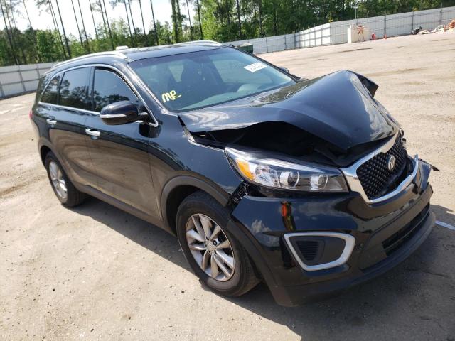 KIA SORENTO LX 2018 with VIN 5XYPG4A32JG408943 - Photo from auction