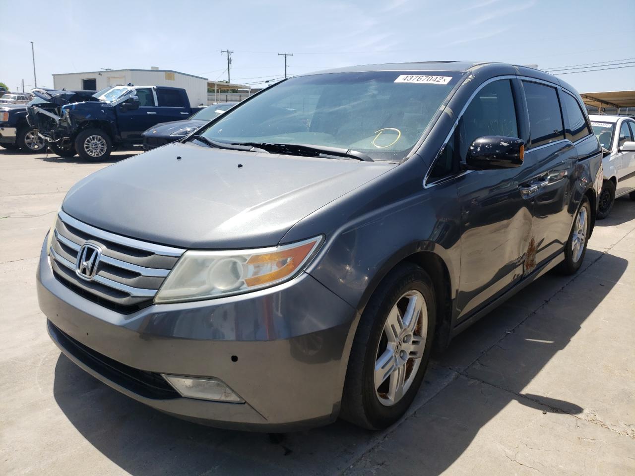 Photo 2 from auction – 2011 HONDA ODYSSEY TO with VIN 5FNRL5H96BB076146