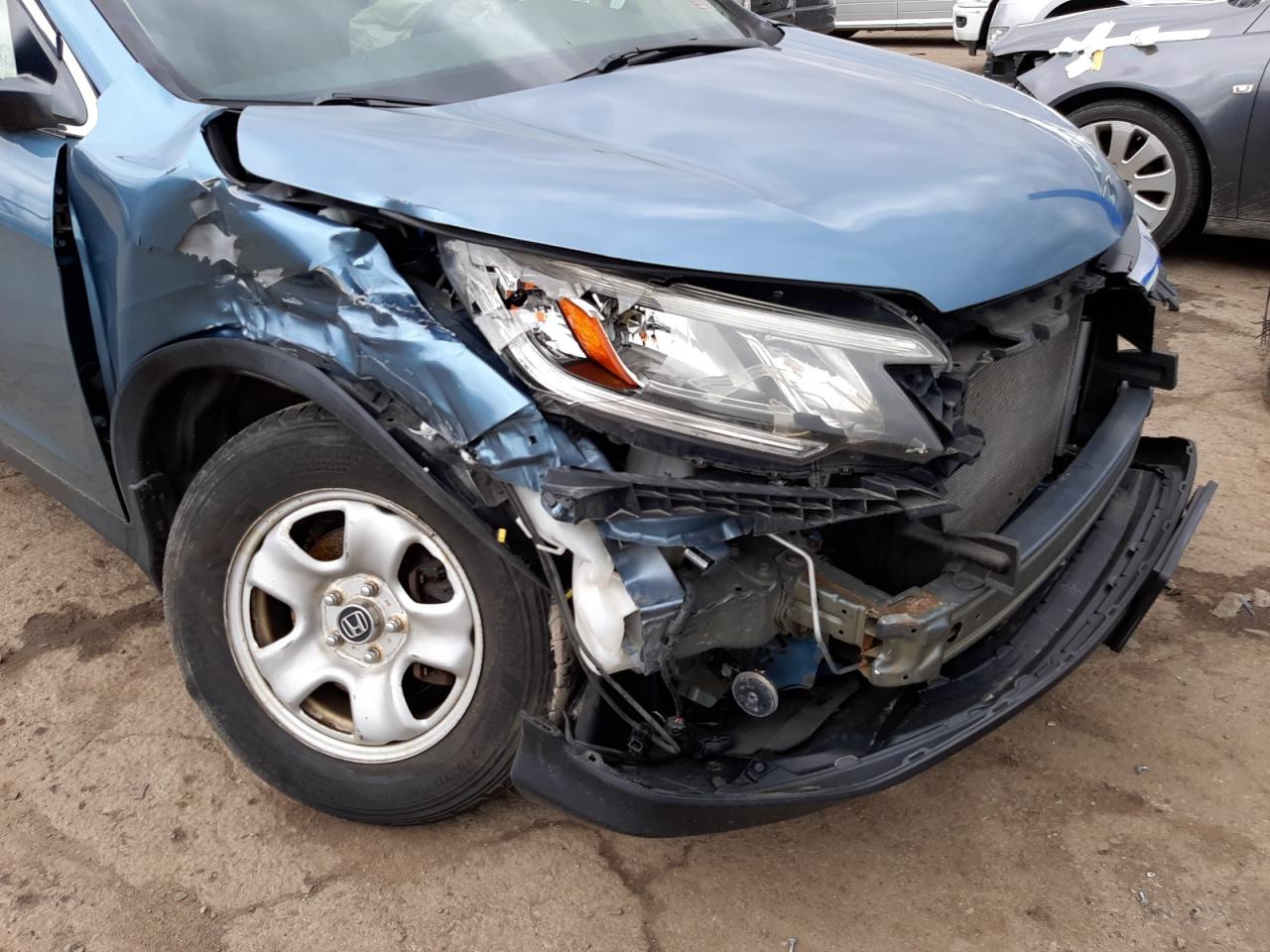 Photo 9 from auction – 2015 HONDA CR-V LX with VIN 5J6RM4H38FL071739