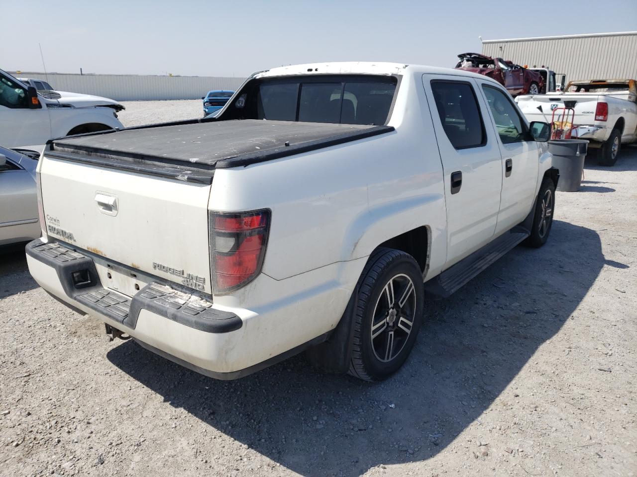Photo 4 from auction – 2013 HONDA RIDGELINE with VIN 5FPYK1F79DB016753
