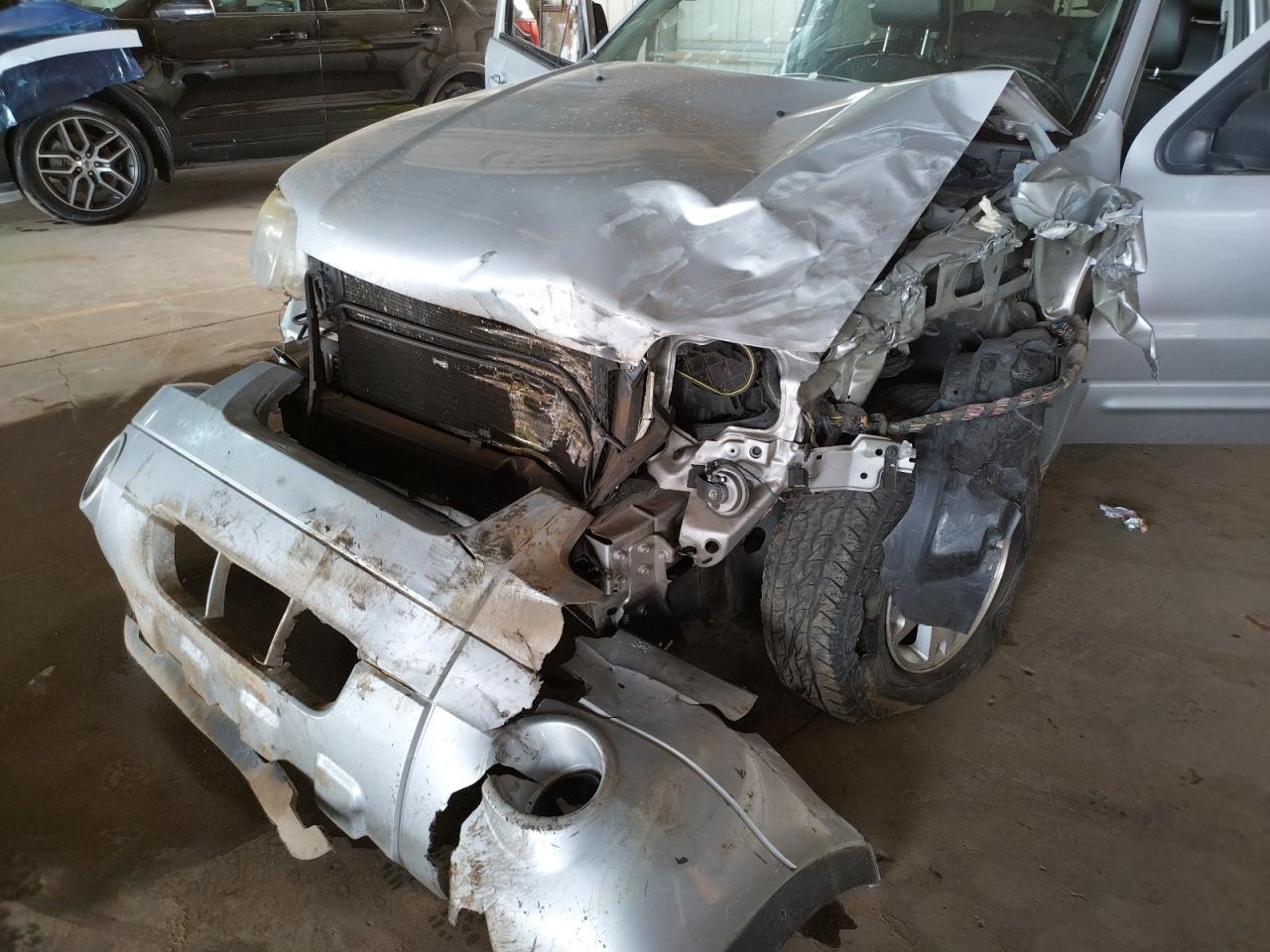 Photo 9 from auction – 2007 FORD ESCAPE LIM with VIN 1FMCU04117KA43955