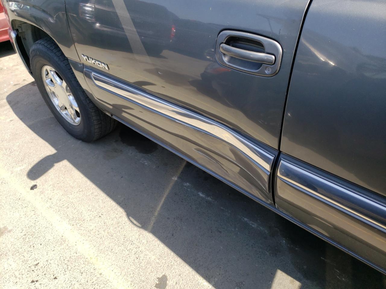 Photo 9 from auction – 2002 GMC YUKON with VIN 1GKEC13V22J277454