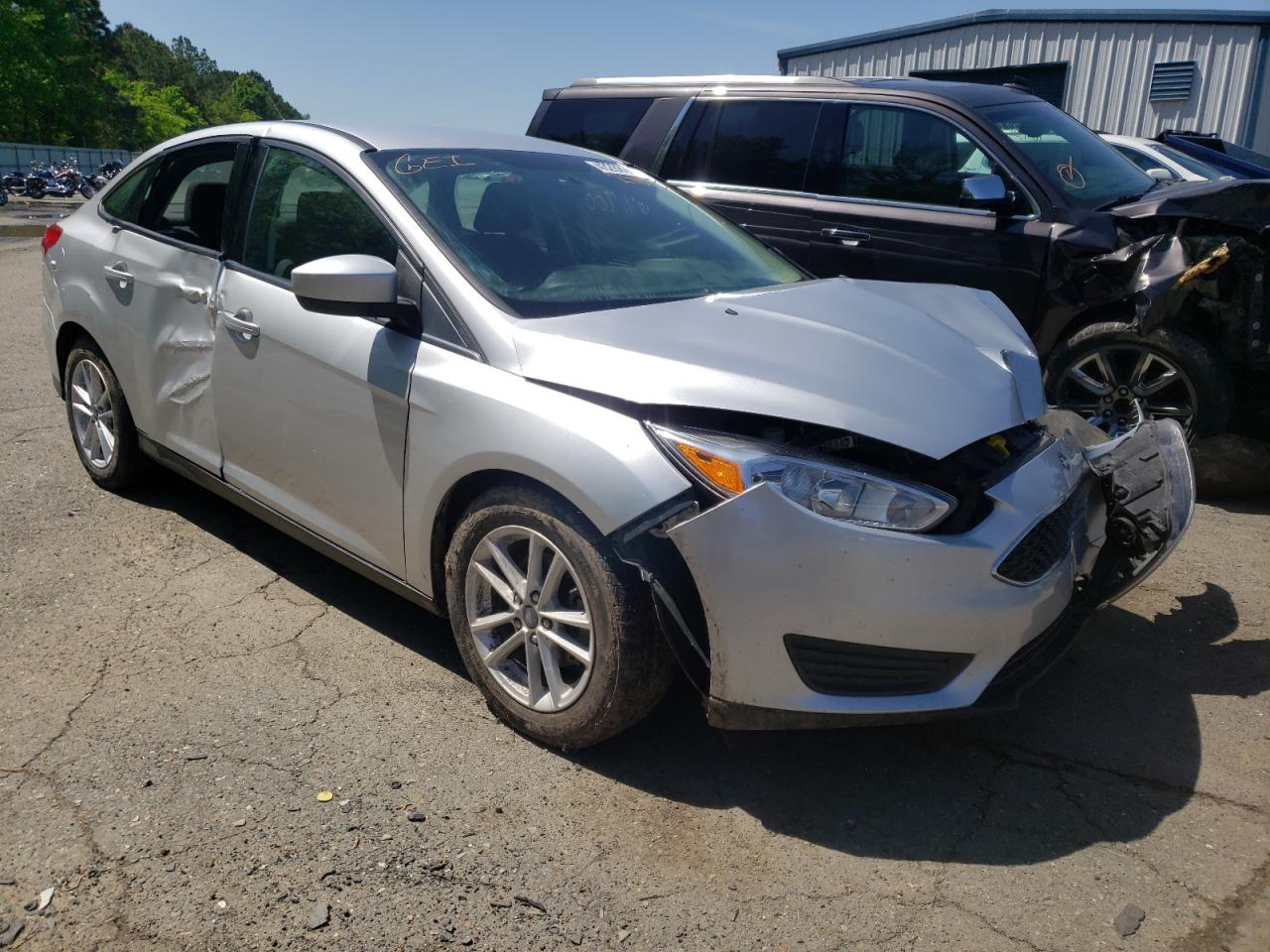 FORD FOCUS SE 2018 with VIN 1FADP3F20JL288602 - Photo from auction