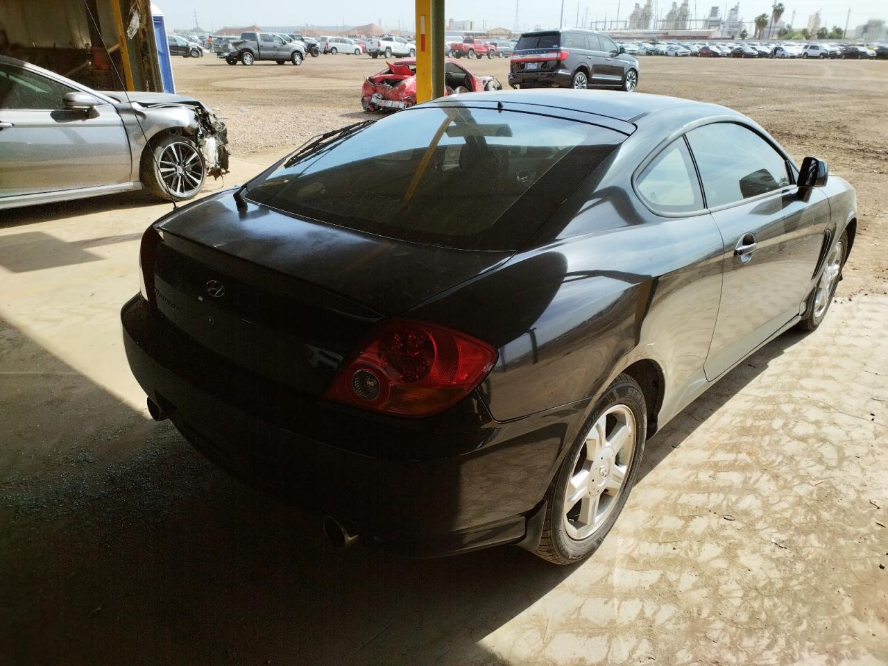 Photo 4 from auction – 2003 HYUNDAI TIBURON with VIN KMHHM65D23U036500