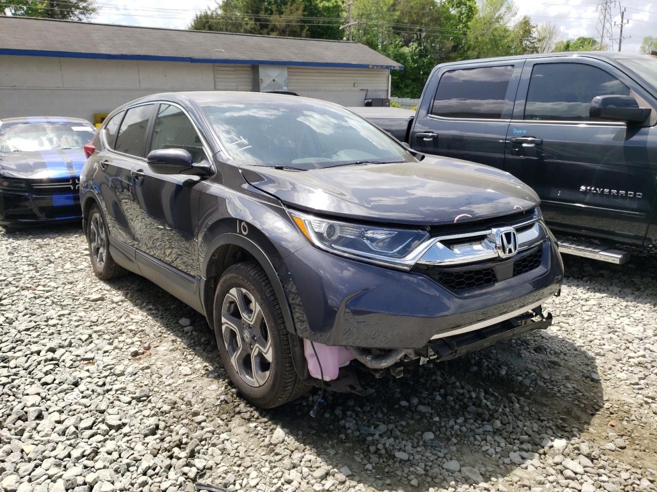HONDA CR-V EX 2018 with VIN 7FARW1H59JE030651 - Photo from auction