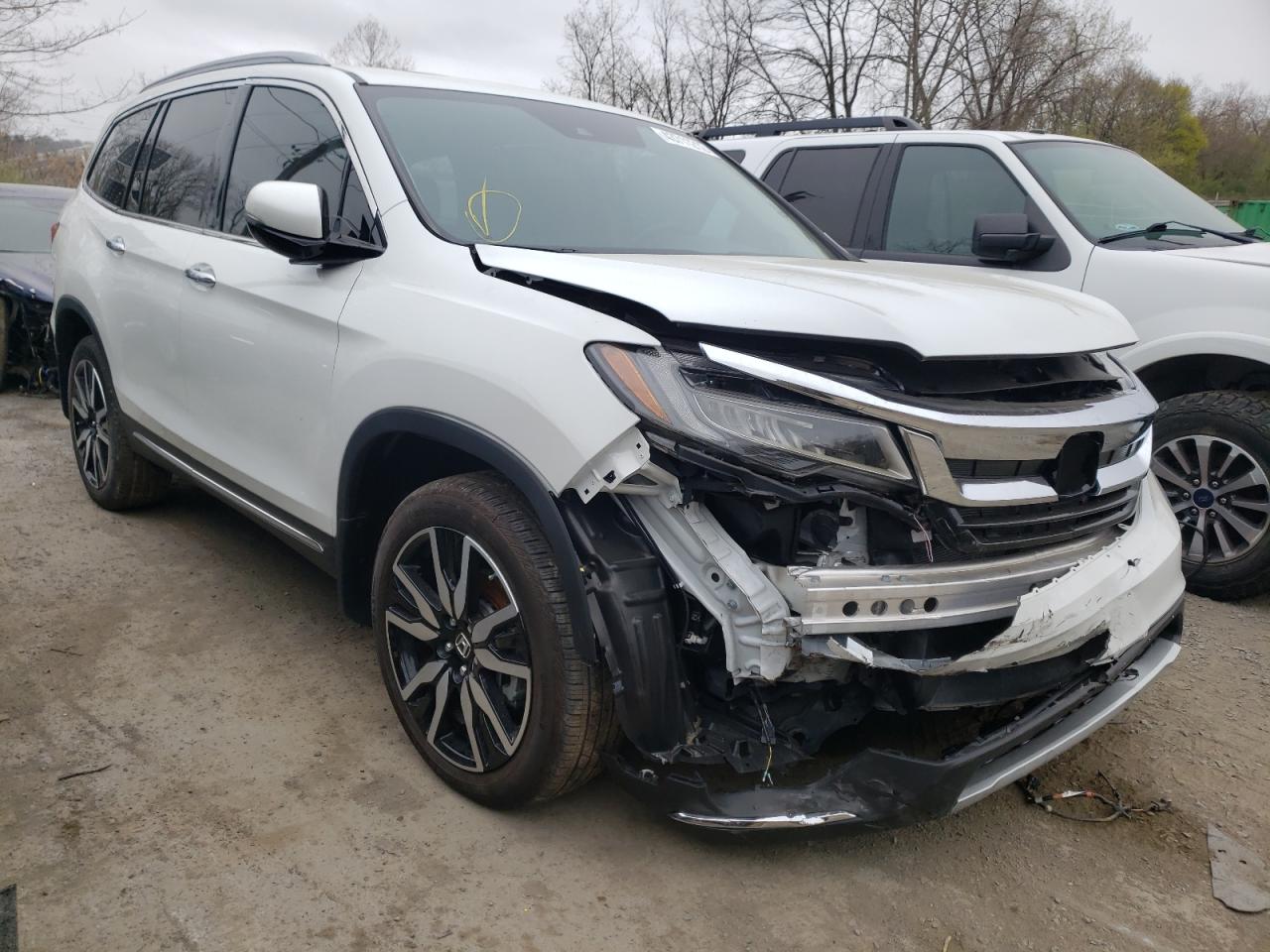 HONDA PILOT TOUR 2021 with VIN 5FNYF5H64MB011968 - Photo from auction