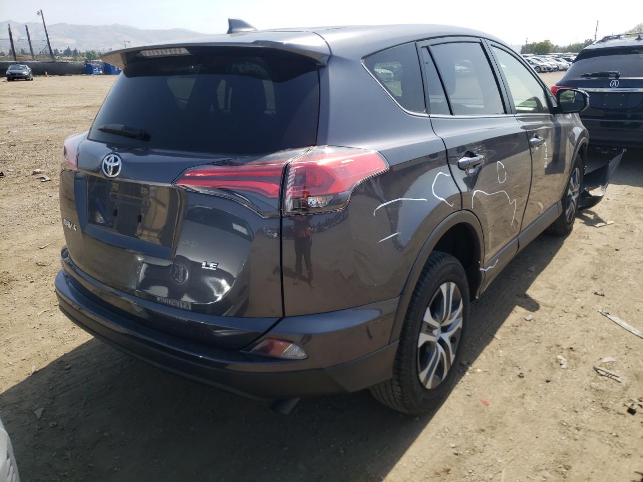 Photo 4 from auction – 2018 TOYOTA RAV4 LE with VIN JTMZFREV4JJ211485