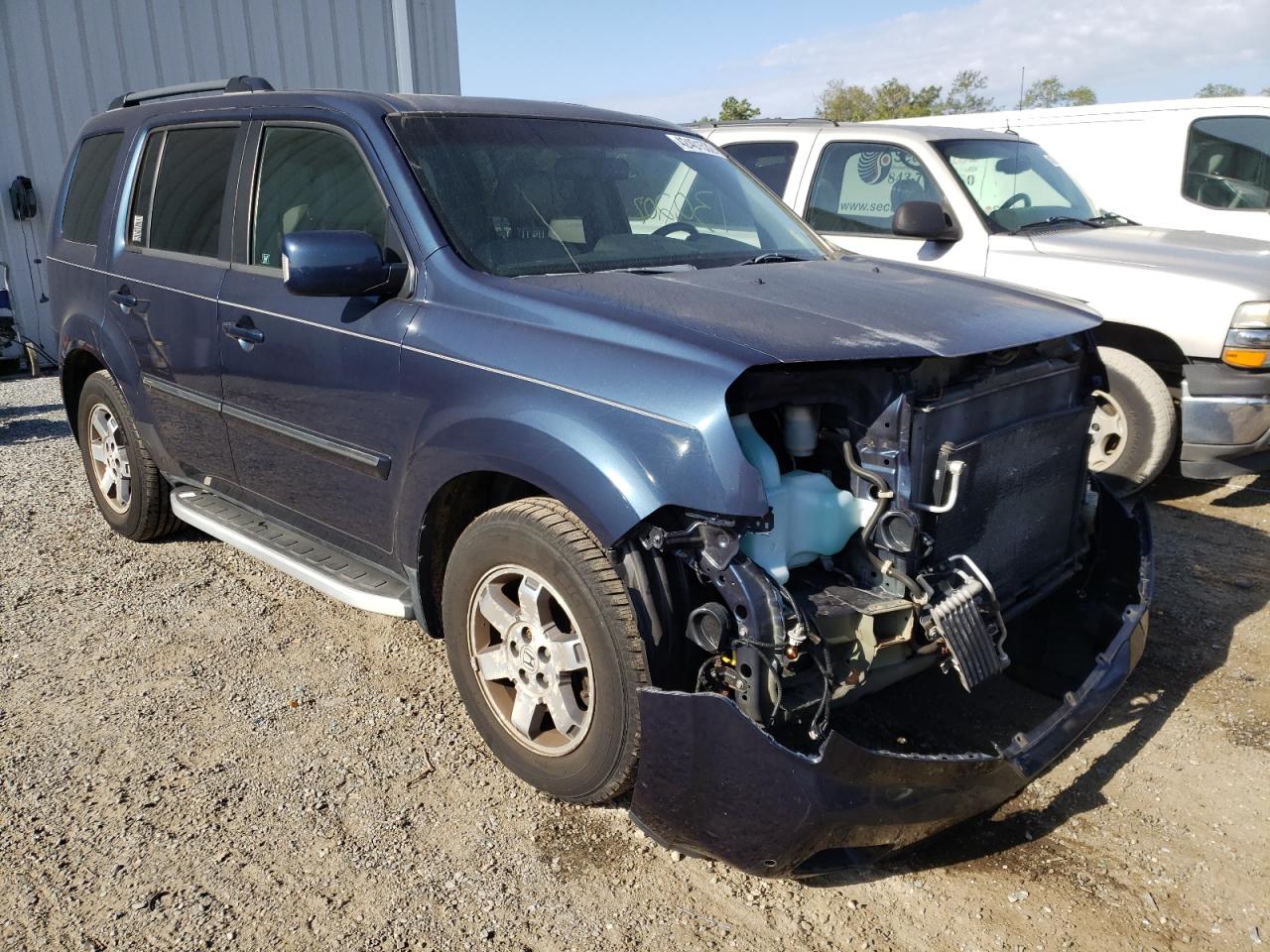 HONDA PILOT TOUR 2011 with VIN 5FNYF4H90BB094865 - Photo from auction