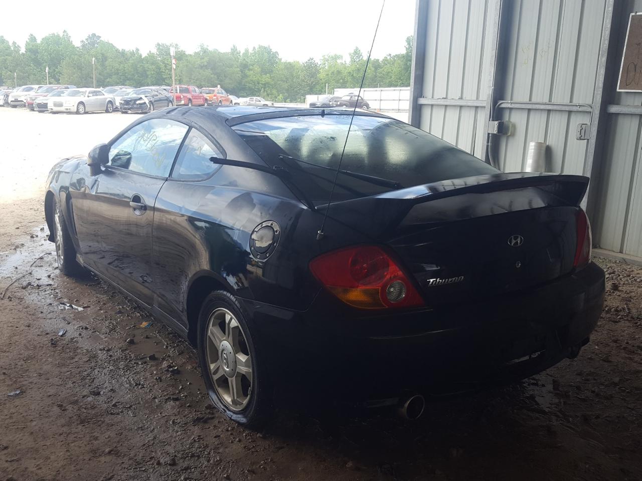 Photo 3 from auction – 2004 HYUNDAI TIBURON with VIN KMHHM65D14U140249