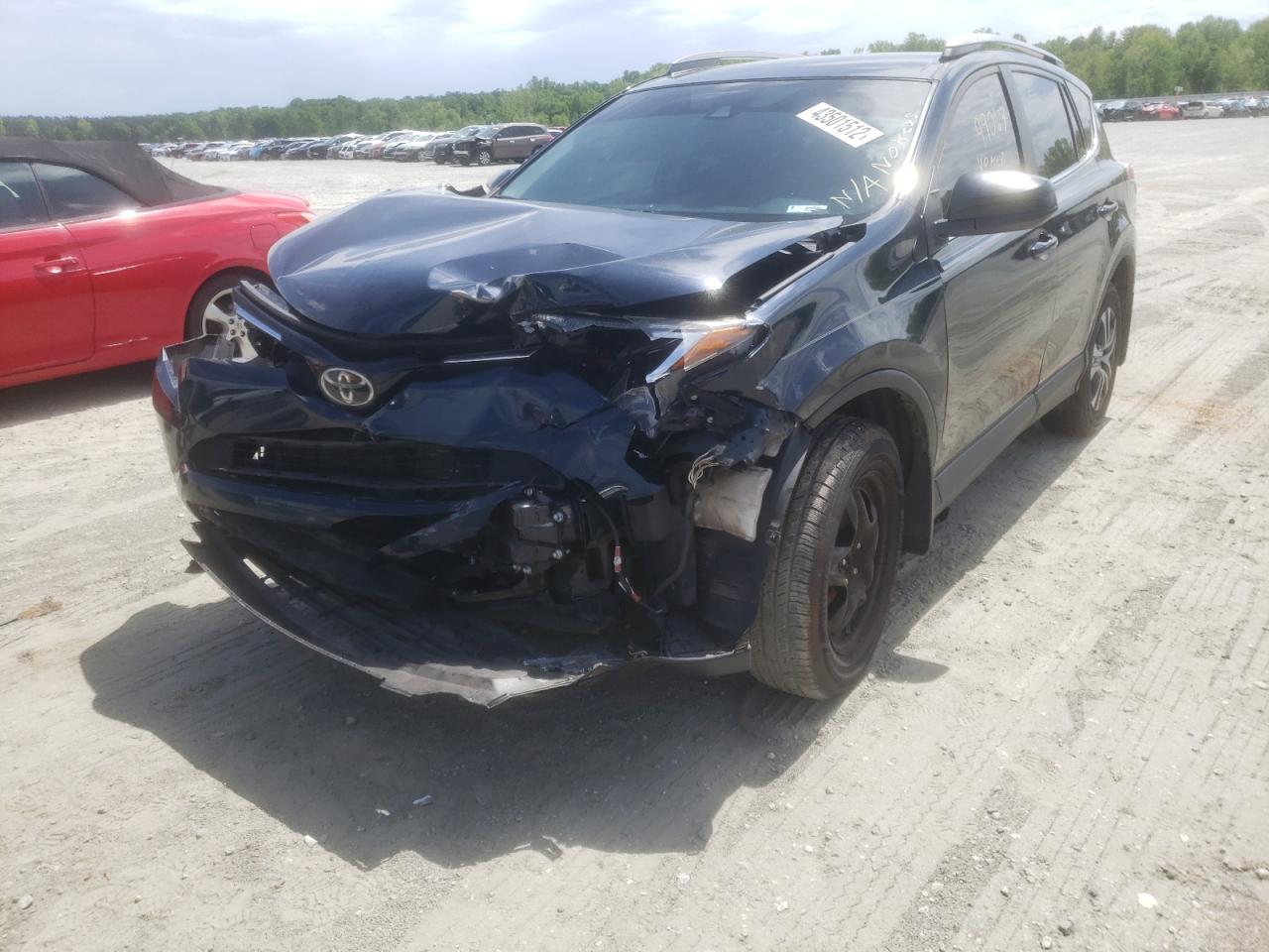 Photo 2 from auction – 2017 TOYOTA RAV4 LE with VIN 2T3BFREV3HW550252