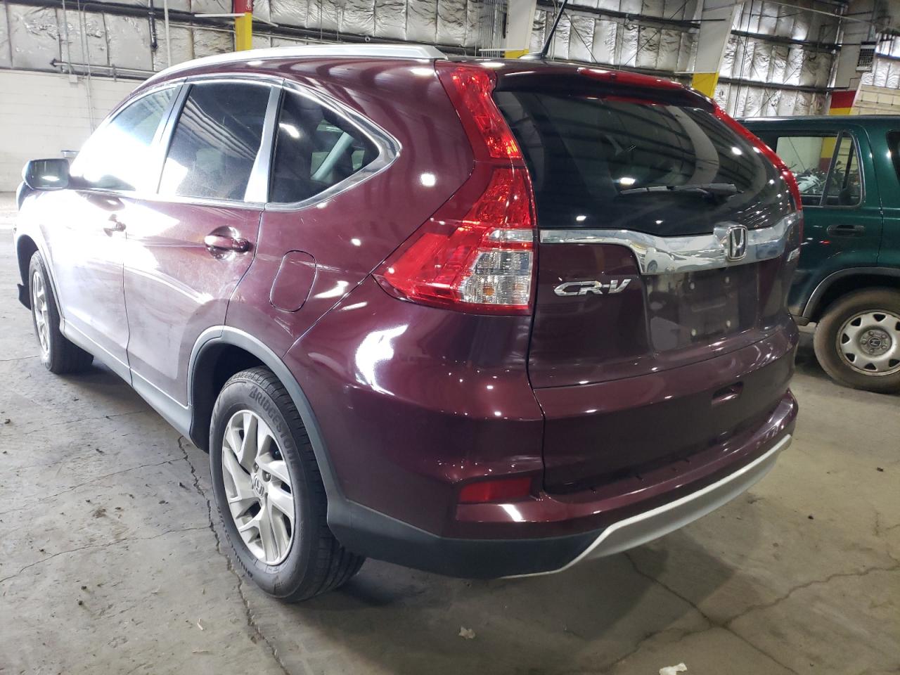 Photo 15 from auction – 2015 HONDA CR-V EXL with VIN 2HKRM4H76FH652458