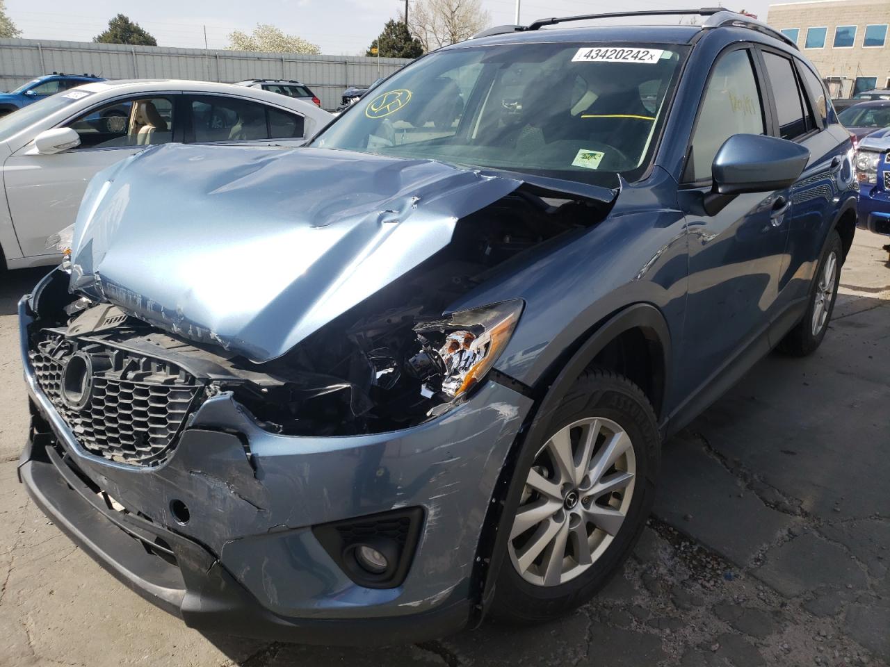 Photo 2 from auction – 2014 MAZDA CX-5 TOURI with VIN JM3KE4CY3E0422913