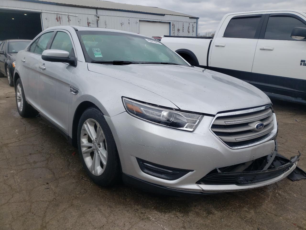 FORD TAURUS SEL 2014 with VIN 1FAHP2H89EG169765 - Photo from auction