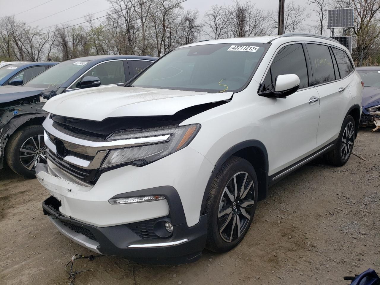 Photo 2 from auction – 2021 HONDA PILOT TOUR with VIN 5FNYF5H64MB011968