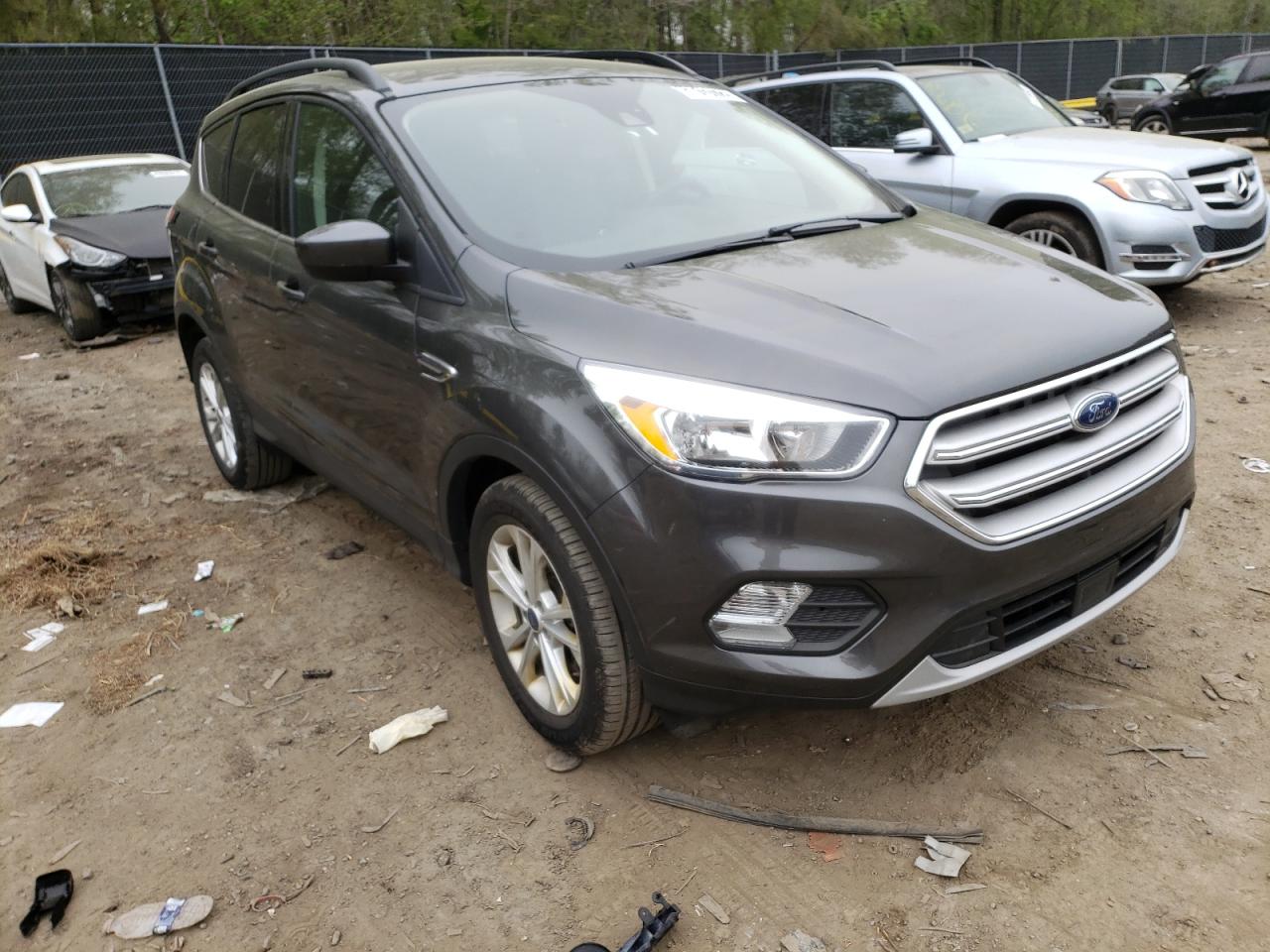 FORD ESCAPE SE 2018 with VIN 1FMCU9GD2JUC74952 - Photo from auction