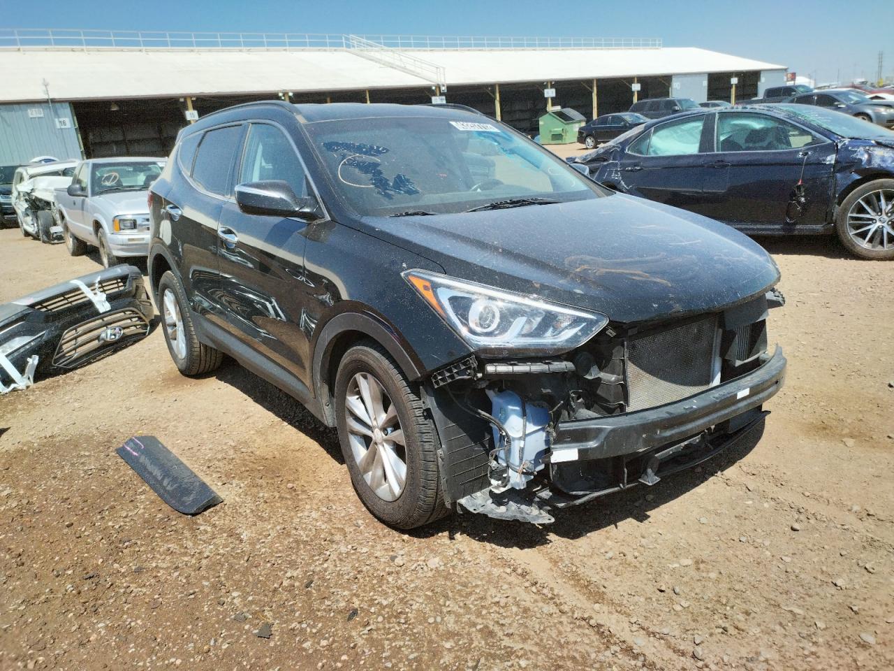 HYUNDAI SANTA FE S 2017 with VIN 5NMZU4LA5HH037337 - Photo from auction