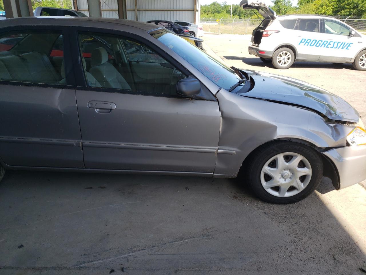 Photo 9 from auction – 1999 MAZDA PROTEGE DX with VIN JM1BJ2229X0130532