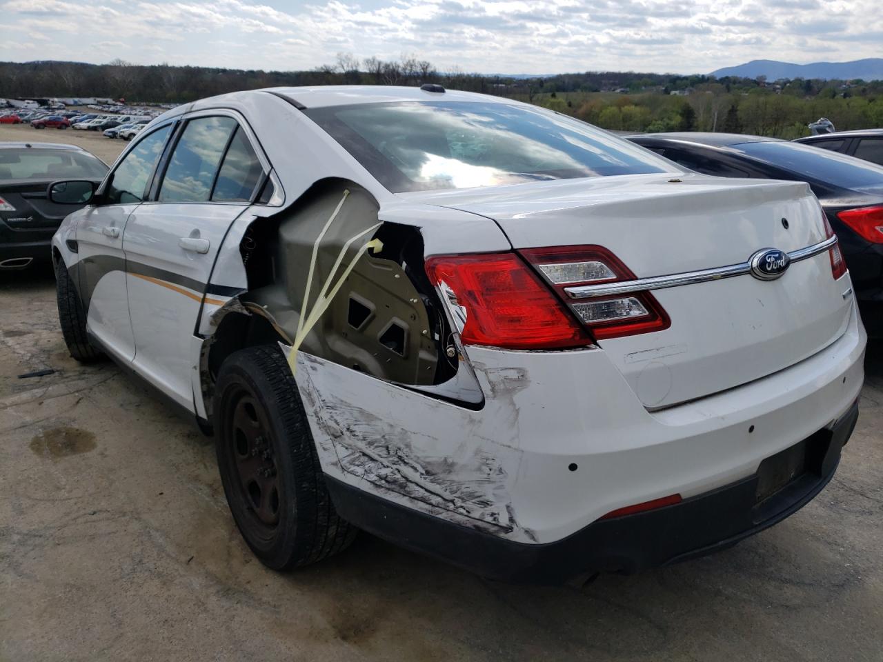 Foto 3 de la subasta – 2014 FORD TAURUS POL con VIN 1FAHP2MKXEG125985