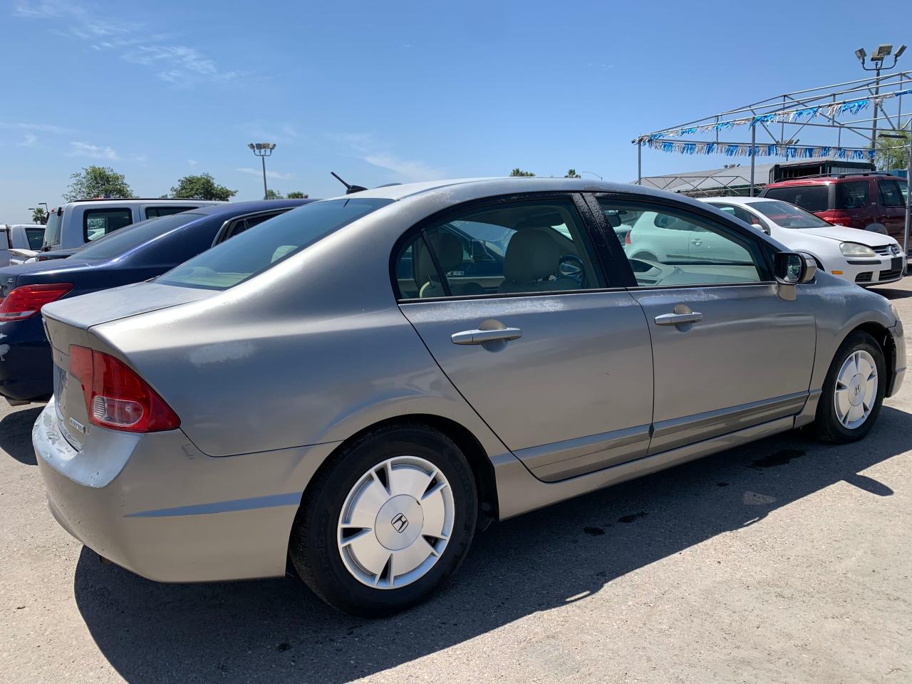 Photo 4 from auction – 2006 HONDA CIVIC HYBR with VIN JHMFA36286S020252